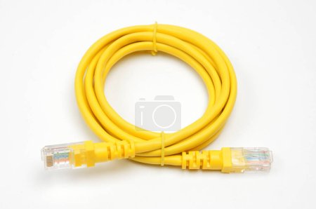 Photo for LAN cable with Registered Jack RJ45 plug on isolated white backgroun - Royalty Free Image