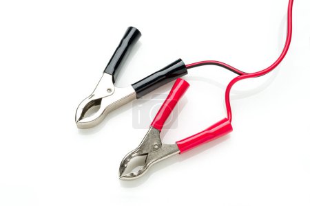 Photo for Red and black clip-on connecting and charging cable for 12 Volt battery isolated on white background - Royalty Free Image