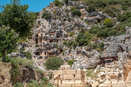 Photo for The ruins of the amphitheater and ancient rock tombs in the ancient city of Myra in Demre, Turkey - Royalty Free Image
