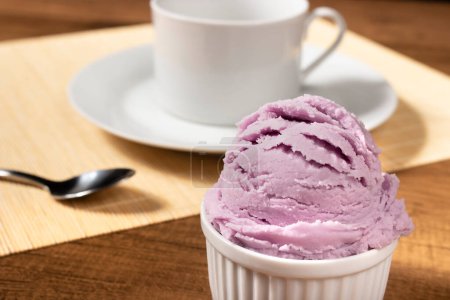 Photo for Delicious purple grape flavored ice cream. Refreshing meal. Ice cream and ice cream parlors - Royalty Free Image