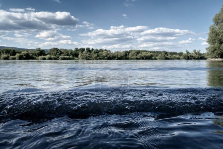 Photo for Low angle view of River Rhine with small wave near Ingelheim, Germany - Royalty Free Image