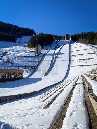 Photo for Courchevel, France - February 13, 2023: Ski jumping hill used for the Olympic Winter Games 1992 against blue sky - Royalty Free Image