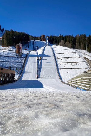 Photo for Courchevel, France - February 13, 2023: Ski jumping hill used for the Olympic Winter Games 1992 against blue sky - Royalty Free Image