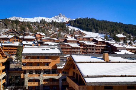 Photo for Cityscape of Meribel, France in winter against blue sky - Royalty Free Image