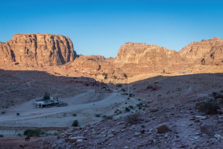 Photo for Scenic view of Colonnaded Street and Qasr al-Bint in the historic and archaeological city of Petra, Jordan from Al-Kubtha Trail against blue sky - Royalty Free Image