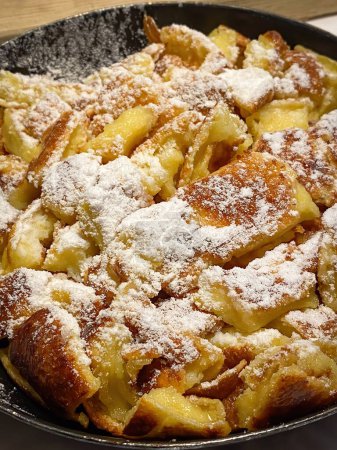 Photo for Famous Austrian sweet dish Kaiserschmarrn served in a pan - Royalty Free Image