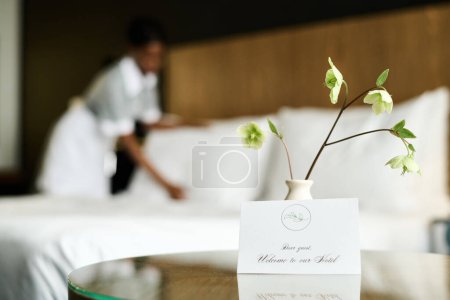 Background image of luxury hotel room with welcome note in foreground copy space