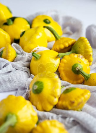 Photo for Yellow squash nestled in a linen - Royalty Free Image