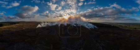 Photo for Heather burning on moorland above Holmfirth in West Yorkshire. - Royalty Free Image