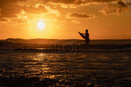 Photo for Boogie Boarding as the sun rises - Royalty Free Image