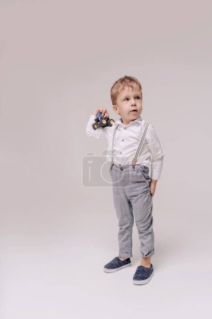 Photo for Portrait of 4 year boy wearing white shirt - Royalty Free Image