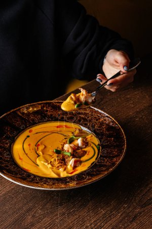 Photo for Pumpkin cream soup with shrimps - Royalty Free Image