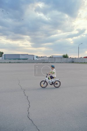 Photo for Boy learning how to ride a bicycle - Royalty Free Image