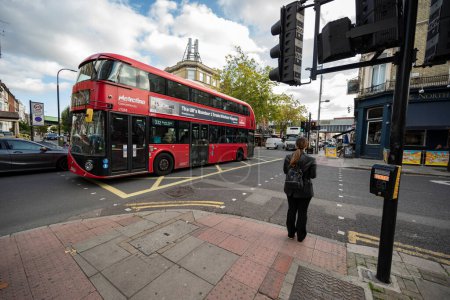 Photo for London bus crossing the streets of Kilburn - Royalty Free Image