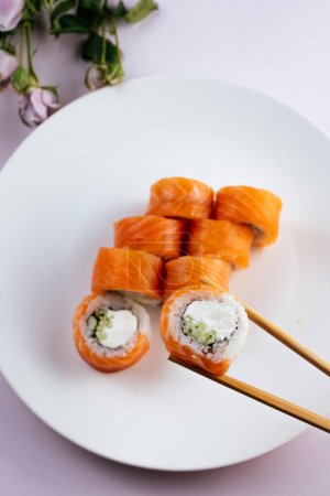 Photo for Philadelphia sushi roll in sticks - Royalty Free Image