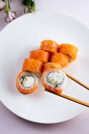 Photo for Philadelphia sushi roll in sticks - Royalty Free Image