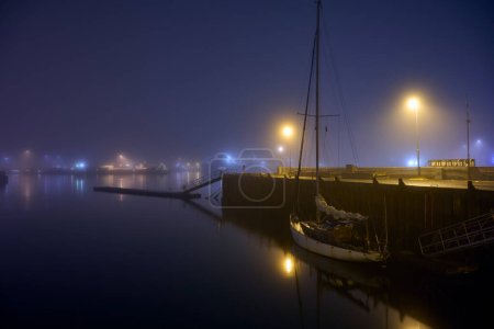 Photo for Boat moored in port at night - Royalty Free Image