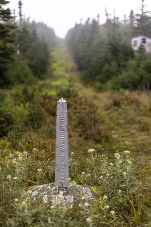 Photo for Stone border marker along international boundary USA Canada - Royalty Free Image