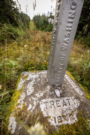 Photo for Stone border monument along international Maine and Quebec border - Royalty Free Image