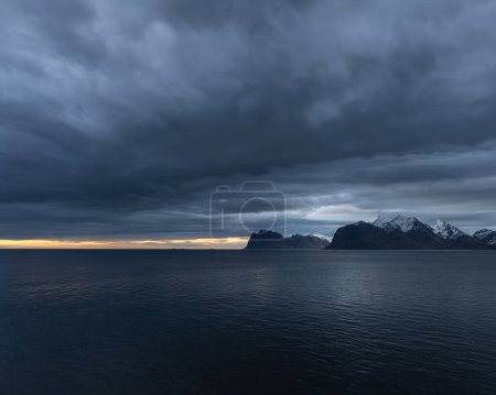 Photo for Dark clouds over the waters of Nappstraumen, Lofoten Islands, Norway - Royalty Free Image