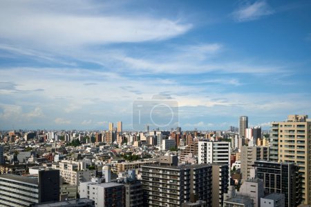 Photo for Tokyo Urban Skyline Against a Partly Cloudy Sky - Royalty Free Image