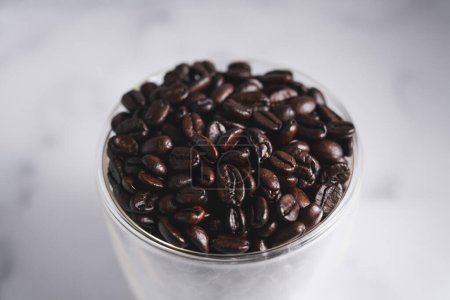 Photo for Coffee Beans s in Glass Mug, Overhead View - Royalty Free Image