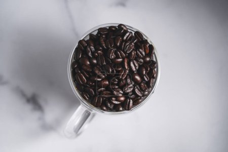 Photo for Coffee Beans s in Glass Mug, Overhead View - Royalty Free Image