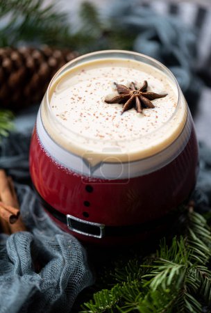 Photo for Eggnog in a santa cup for dessert - Royalty Free Image