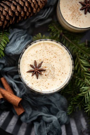 Photo for Overhead shot of eggnog with star anise and cinnamon - Royalty Free Image
