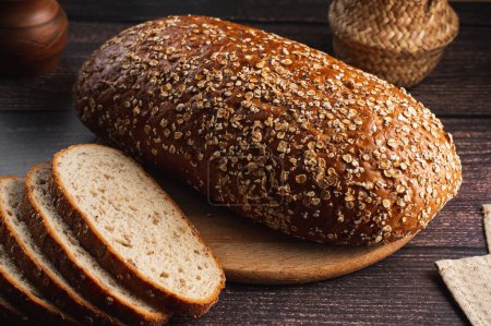 Photo for Homemade bread with seeds on a wooden background - Royalty Free Image