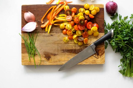 Photo for Birds eye fresh ingredients cutting board with knife - Royalty Free Image