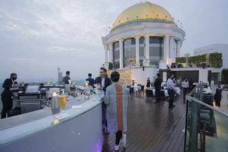 Photo for Lebua Rooftop Sky Bar at Sunset with Bangkok Urban Megalopolis - Royalty Free Image