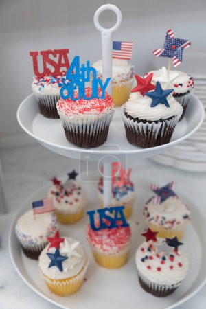 Photo for Close-up of Fourth of July themed cupcakes on display stand - Royalty Free Image