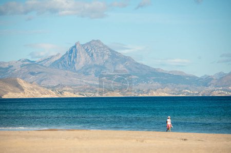 Photo for Alicante, Spain : 2022 November 17 : People walking on the San Juan beach in Alicante in 2022. - Royalty Free Image