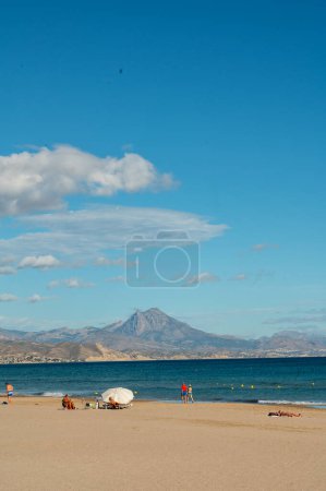 Photo for Alicante, Spain : 2022 November 17 : People on the San Juan beach in autumn in Alicante in 2022. - Royalty Free Image