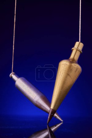 Photo for Brass and iron plumb bobs - Royalty Free Image