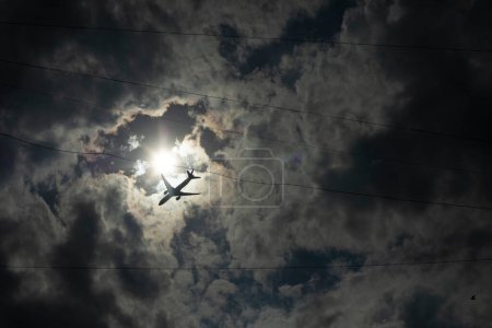 Photo for Airplane among clouds. Air transport in sky. Flight details. Figure of aircraft in airspace. - Royalty Free Image