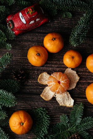 Foto de Christmas image. christmas peeled tangerine and mandarins rustic background top view. xmas seasonal greetings. space for text. winter holidays - Imagen libre de derechos