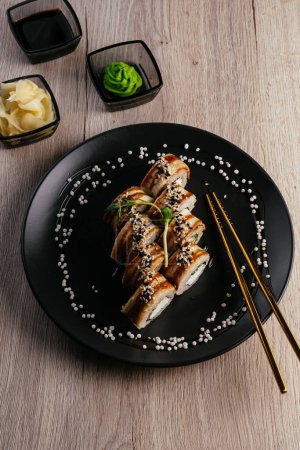 Foto de Sushi roll with eel on a plate.  asian restaurant menu - Imagen libre de derechos