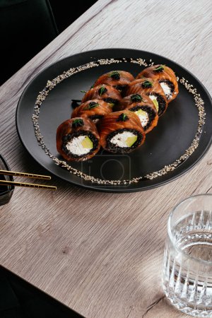 Photo for Philadelphia sushi roll on a plate.  asian restaurant menu - Royalty Free Image