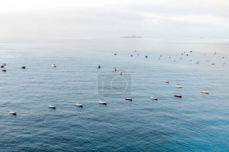 Foto de Calm morning on Amalfi coast with a lot of small boats - Imagen libre de derechos