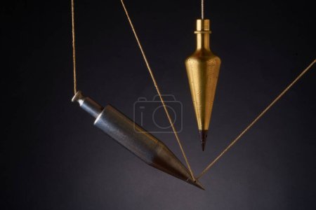 Photo for Plumb bobs, antique surveying equipment - Royalty Free Image