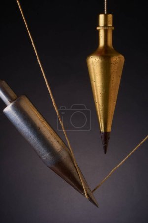 Photo for Plumb bobs, antique surveying equipment - Royalty Free Image