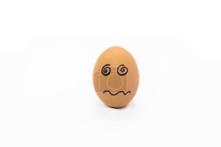 Foto de Egg with confused face on white background - Imagen libre de derechos