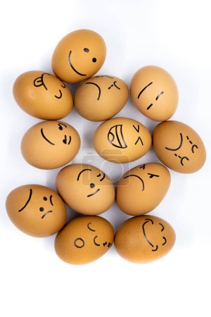 Foto de Many eggs with different reactions seen from above on white background - Imagen libre de derechos