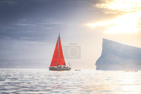 Téléchargez les photos : Sailboat with red sails sailing between huge icebergs - en image libre de droit
