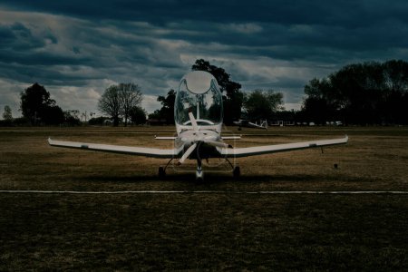 Photo for Airplane parked while an airplane is landind - Royalty Free Image