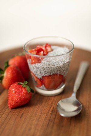 Photo for Strawberry Chia Seed Pudding with Strawberries on Kitchen Countertop - Royalty Free Image