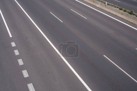 Foto de Road markings, marking different lanes, asphalt floor of a highway - Imagen libre de derechos