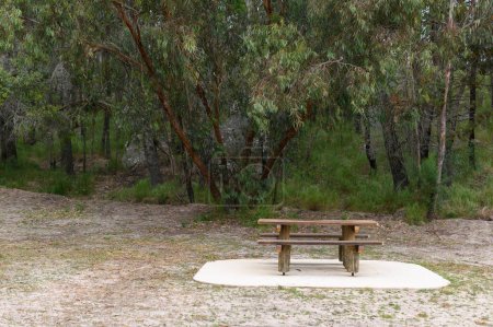 Photo for Wooden Picnic table at Girraween National Park in campground - Royalty Free Image